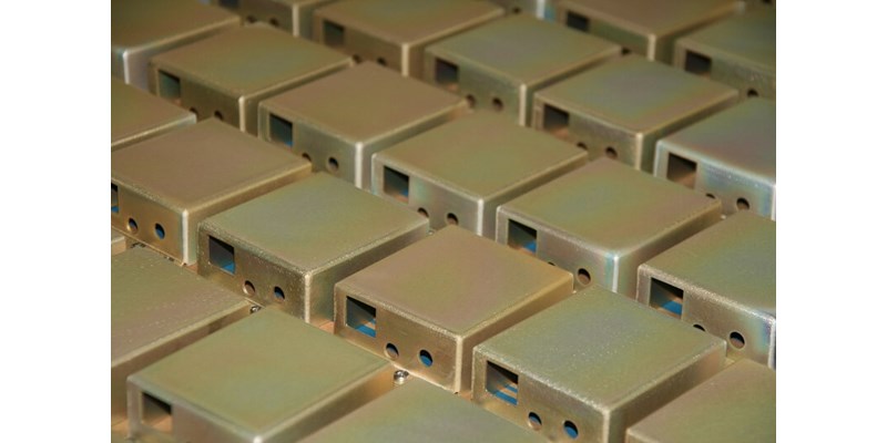 Consistent yellow irradiate plating on fabricated sheet metal products